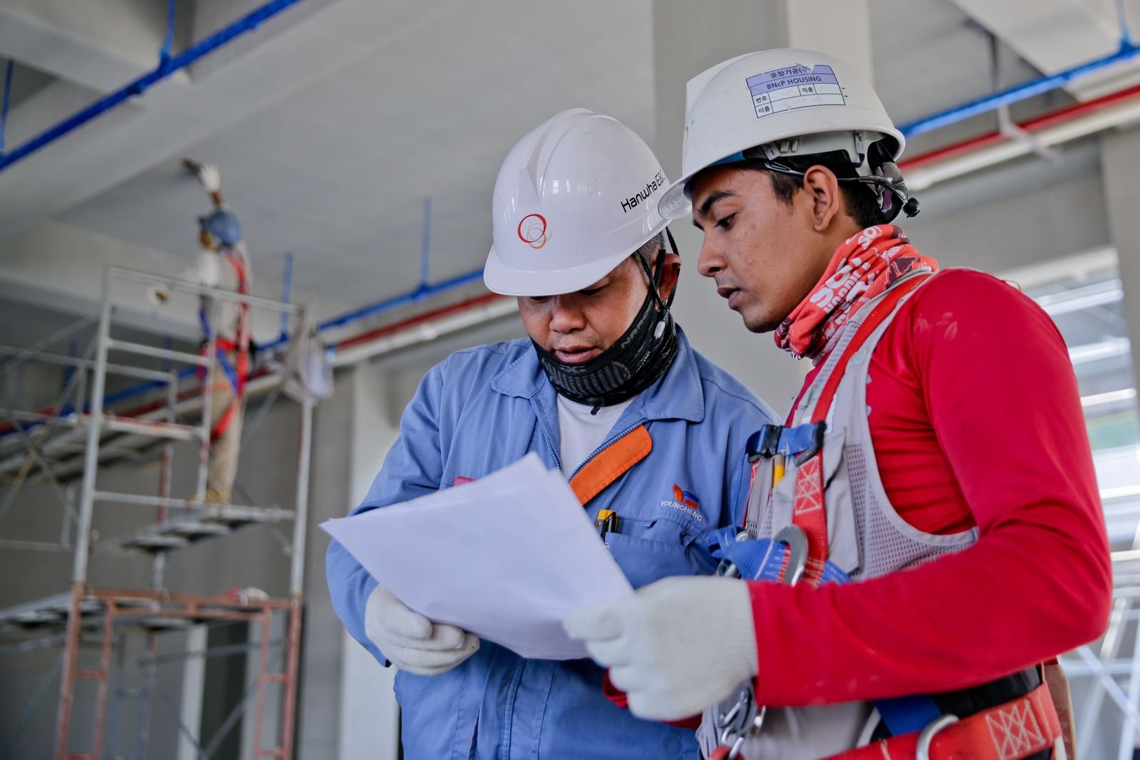 Site engineer reviewing construction drawings
